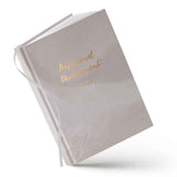 Gray notebook with 'Professional Development' text on a white background