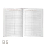 Open notebook with grid pages on a white background