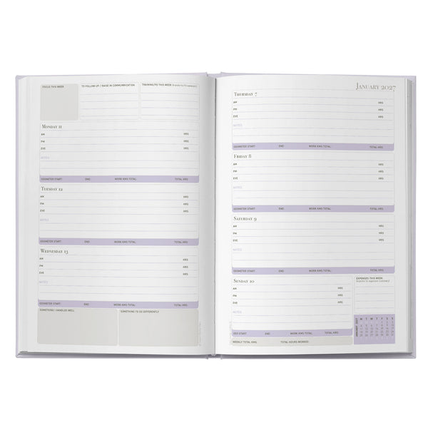 Open daily planner with calendar on a white background