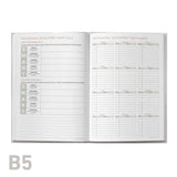 Open planner with professional development sections on a white background